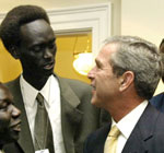 Francis Bok meets with President Bush for the signing of the Sudan Peace Act
