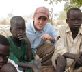 Photojournalist on the ground in southern Sudan, documenting a direct aid mission
